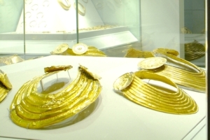 Tourists admiring ancient Celtic Gold on display at the National Museum of Archaeology, Kildare Street